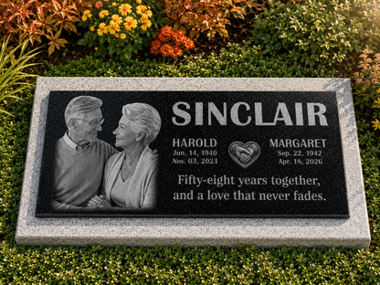 Two portraits engraved on one black granite memorial stone — ADFSTONE